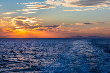 Sunset view from the ferry between Greek islands