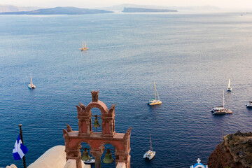 A view of of boats on ocean from Fira, Santorini in the Greek Isles