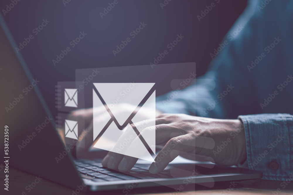Poster businessman hands using laptop typing on keyboard and surfing the internet on office table with emai