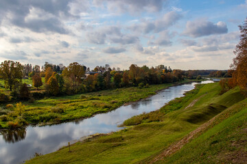 Fototapeta premium Autumn landscape Memele river with colorful trees