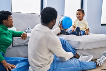 African american family playing with ball at home