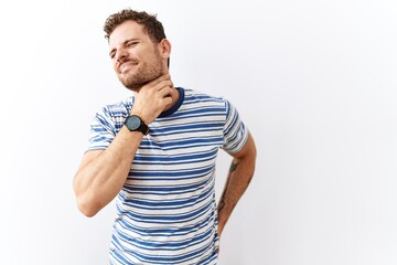 Handsome young man standing over isolated background touching painful neck, sore throat for flu, clod and infection