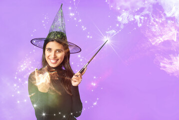 Happy young witch casting a spell, inviting you to join her for halloween celebration