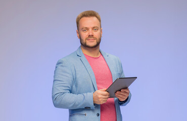 Obraz na płótnie Canvas businessman with tablet isolated on blue background