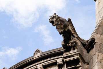 closeup of a gargoyle on a church in paris