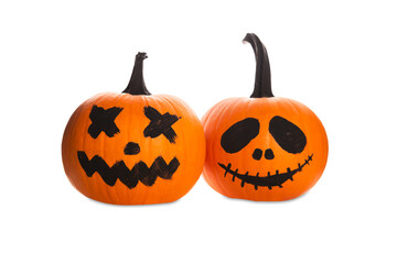 Halloween pumpkins with scary drawn faces on white background