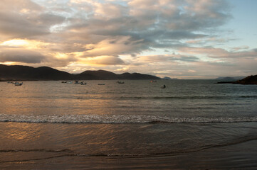 beautiful sunset over the sea in garopaba , brazil