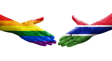 Handshake between Gambia and LGBT flags painted on hands, isolated transparent image.