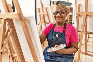 Senior african american woman smiling confident drawing at art studio