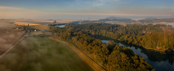 Misty Autumn Morning Sunrise Overlooking the Mighty Skagit River. Aerial drone view of the Skagit...