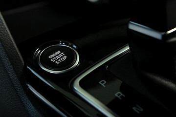 Engine start button in modern car close