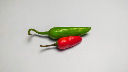 Fresh green chili and red chili pepper isolated on a white background. Mixed chili.