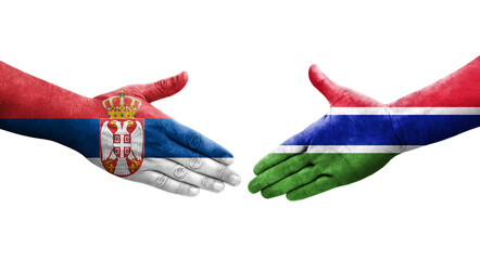 Handshake between Gambia and Serbia flags painted on hands, isolated transparent image.