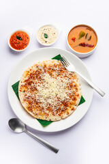 Cheese uttapam pizza, south Indian food with a twist. served with sambar and chutney