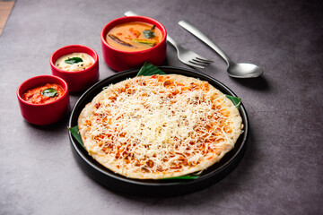 Cheese uttapam pizza, south Indian food with a twist. served with sambar and chutney
