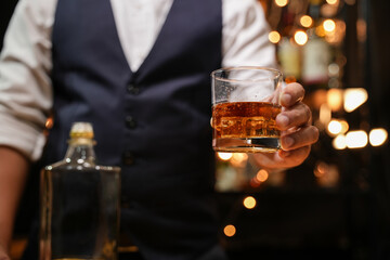Barman pouring whiskey whiskey glass beautiful night