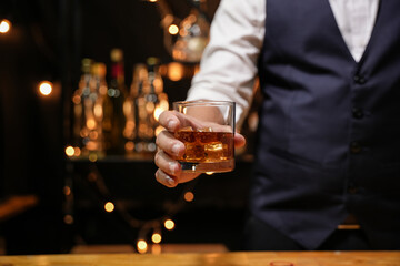 Barman pouring whiskey whiskey glass beautiful night