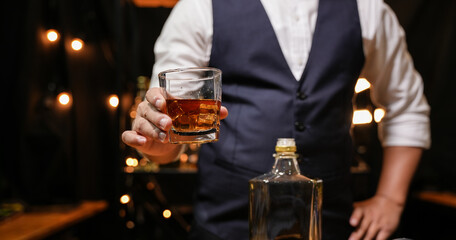 Barman pouring whiskey whiskey glass beautiful night