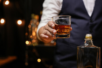 Barman pouring whiskey whiskey glass beautiful night