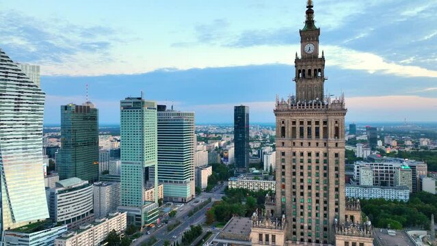 Aerial view of Warsaw modern skyscrapers and palace of culture and science in Poland, flying around famous landmark in Warsaw
