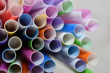 Bright multi-colored straws for cocktails close-up.