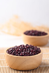 Azuki beans, Adzuki bean or red mung beans in wooden bowl, Food ingredients in many Chinese dishes and filling in Japanese sweet