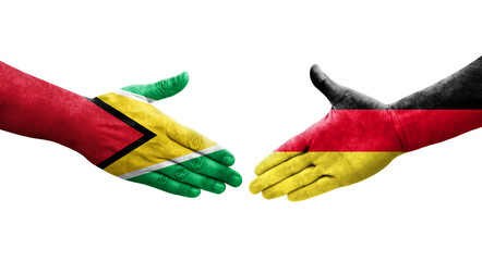 Handshake between Germany and Guyana flags painted on hands, isolated transparent image.