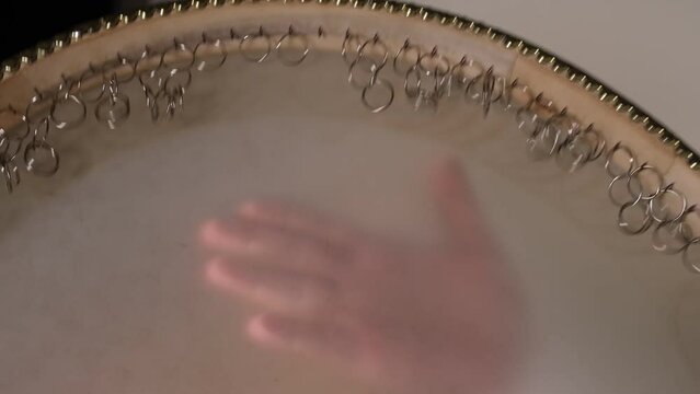 man playing oriental music instrument