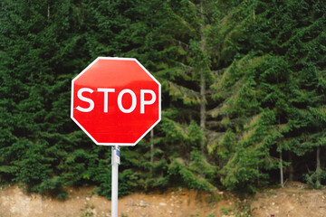 Stop sign. Traffic sign. STOP sign on pole near the road.