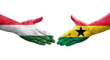 Handshake between Ghana and Hungary flags painted on hands, isolated transparent image.