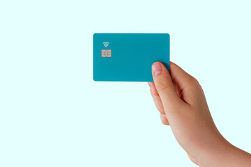 Hand holding a credit or debit card.