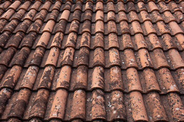 Old red terracotta roof tiles. Texture. Background pattern. Abstract.