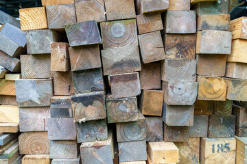 Wood building materials for backgrounds and textures. Close up. Pile of wood. Small depth of field.