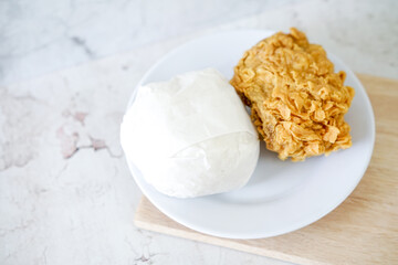 Fried chicken crisp with rice, fast food meal on a white plate 