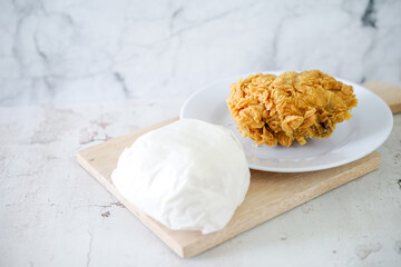 Fried chicken crisp with rice, fast food meal on a white plate 