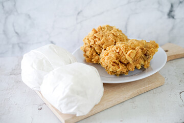 Fried chicken crisp with rice, fast food meal on a white plate 