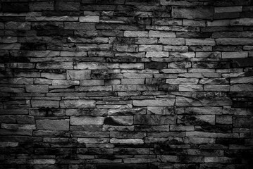 Fototapeta premium Dark black brick texture of brick wall for seamless background and textured.