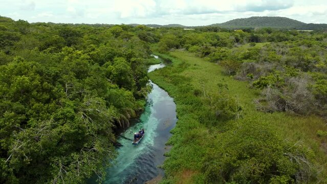 flying over a Boat in the crystalline water of Sucuri river - Bonito, Mato Grosso do Sul - Brazil