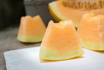 sliced of melons, fresh Melon or cantaloupe, Cantaloupe melons on wood background, Favorite fruit in summer