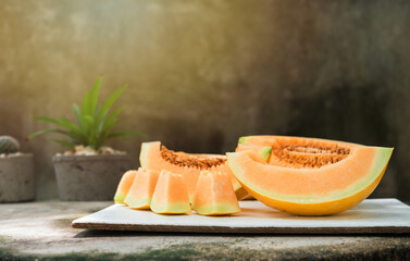 sliced of melons, fresh Melon or cantaloupe, Cantaloupe melons on wood background, Favorite fruit in summer