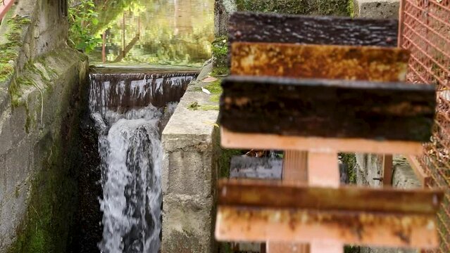 Water Spins The Wheel Of The Water Mill
