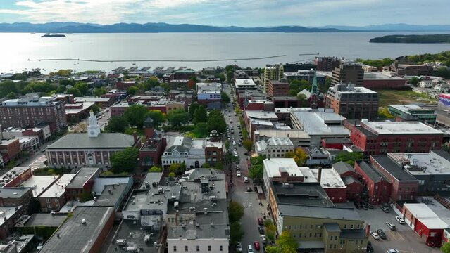 Burlington Vermont. Aerial truck shot of VT town with Lake Champlain in distance. Urban downtown. Black Lives Matter painted on street.