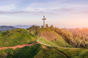 Easter concept. Beautiful landscape with road leads up to cross. Religion concept.Christianity...