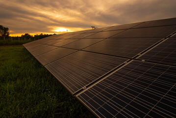  Beautiful sunset over Solar Farm with sunset on the background