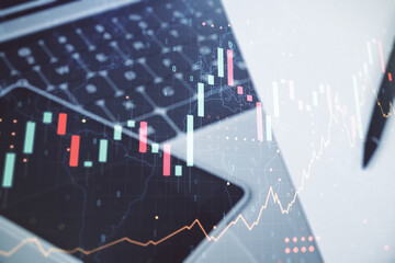 Multi exposure of abstract creative financial graph with world map on modern laptop background, forex and investment concept