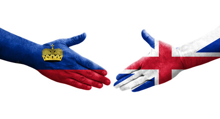 Handshake between Great Britain and Liechtenstein flags painted on hands, isolated transparent image.