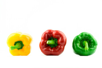 Fresh colorful sweet bell peppers on white background
