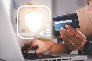 Female register via credit cards on computer make electronic payment security online, Woman hands holding credit card and using laptop with product purchase at home, Internet online shopping concept