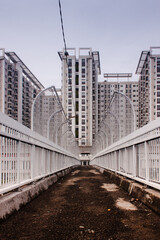 Pedestrian bridge with an apartment in the back of Jakarta Indonesia 
