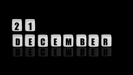 December 21th. Day 21 of month, Calendar date. White cubes with text on black background with...